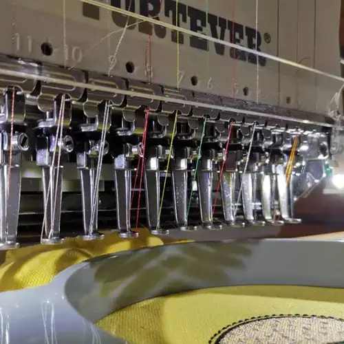 Close up view of one of Cotton Polly's embroidery machines at work