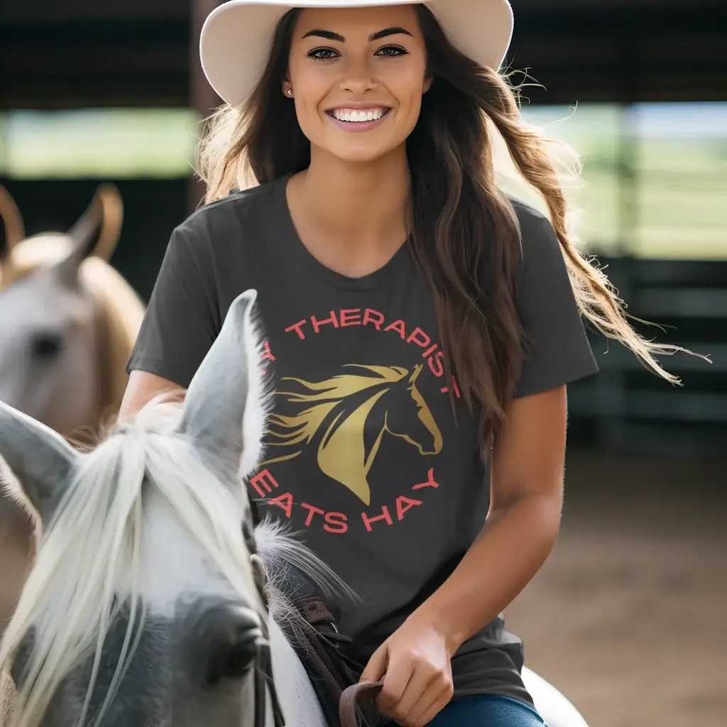 an attractive lady on a horse wearing a t-shirt that has been embellished in vinyl by Cotton Polly